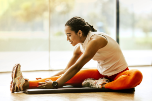 Woman with arthritis doing gentle seated stretches to improve joint mobility and reduce pain