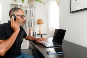 Person with arthritis connecting virtually to reduce feelings of social isolation.